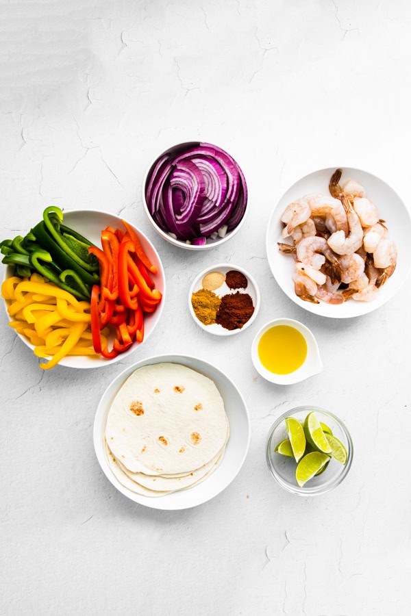 Sheet Pan Shrimp Fajitas ingredients on a table. 