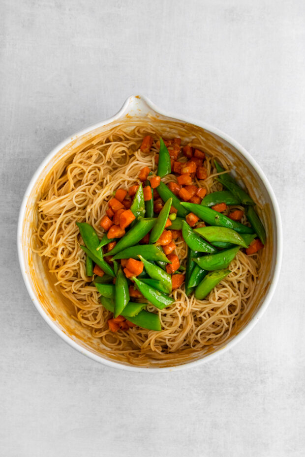 Spicy Peanut Noodles with veggies in a bowl.