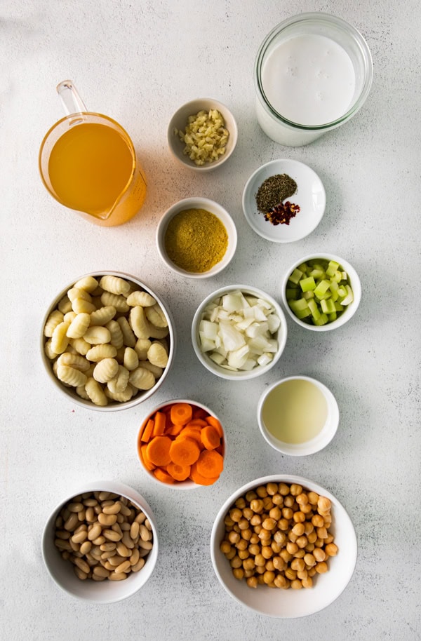 Ingredients to make Vegetable Gnocchi Soup sitting on a table.