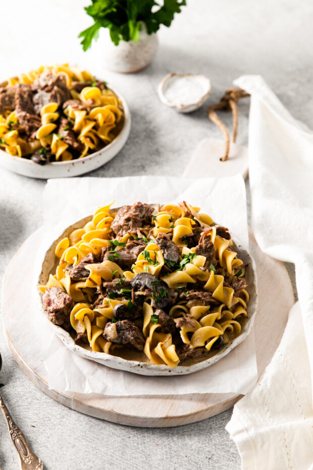 Slow Cooker Beef Stroganoff served with egg noodles. 