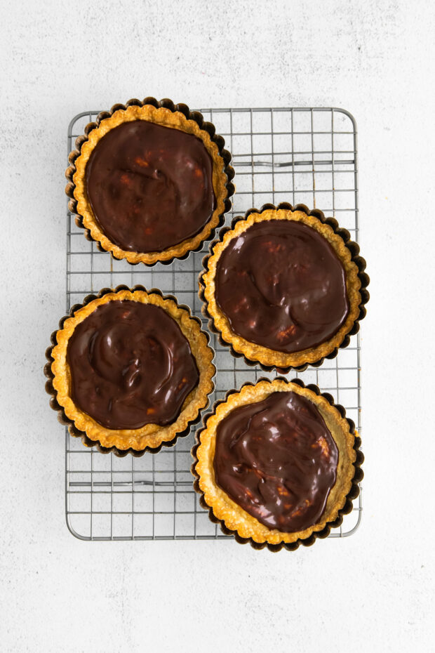 Pie crusts spread with chocolate ganache.