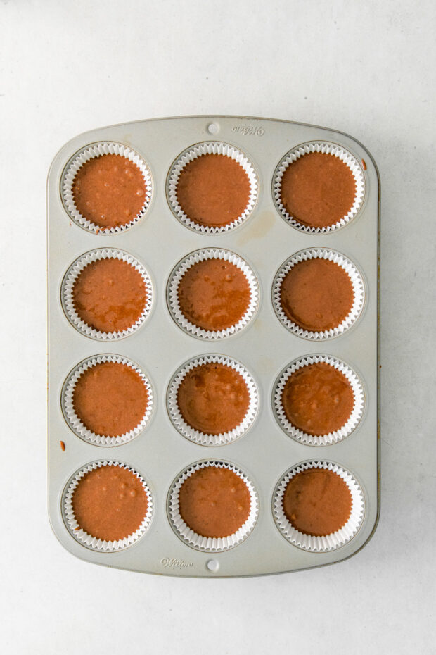 Chocolate cupcake batter in a pan. 