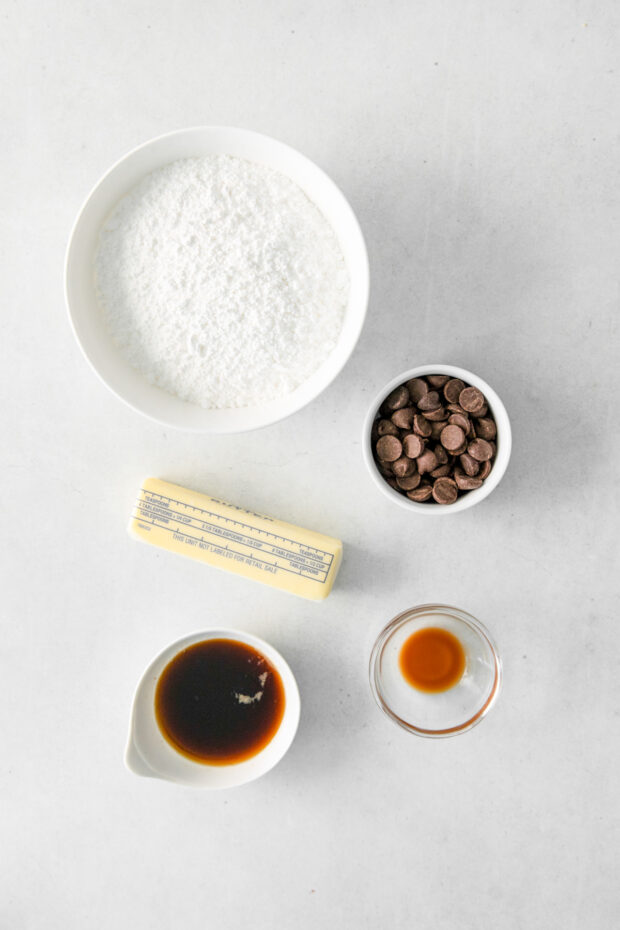 Ingredients for chocolate frosting on a table. 