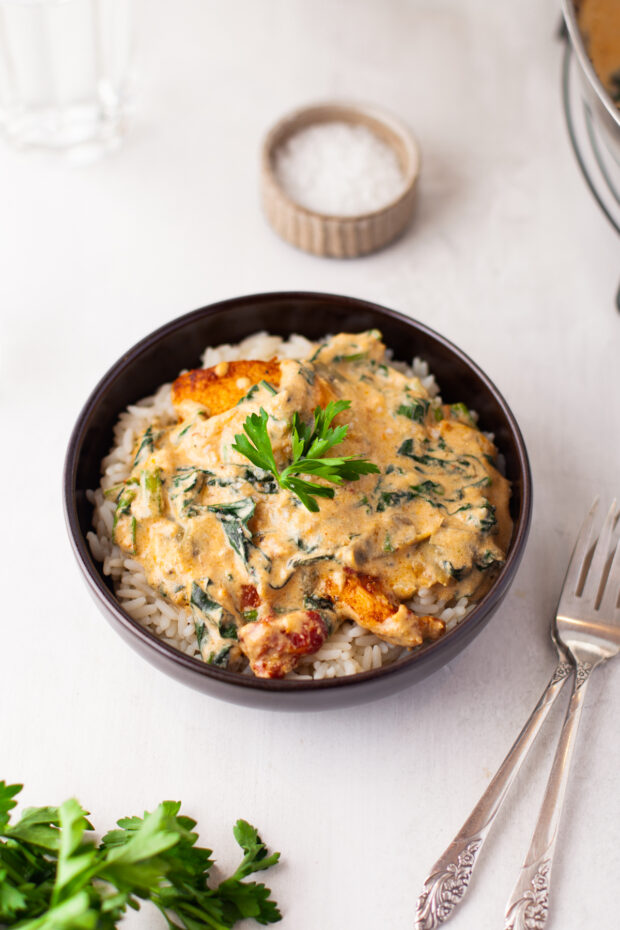 Creamy Tuscan Chicken served over rice 