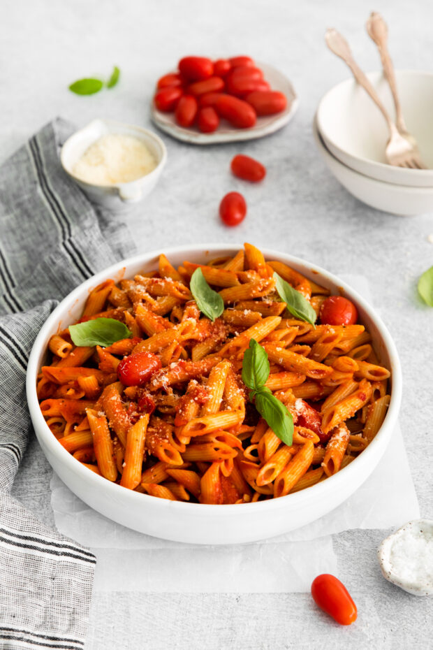 Penne Arrabbiata topped with basil and parmesan cheese. 
