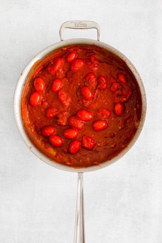 Tomatoes cooking in a skillet. 