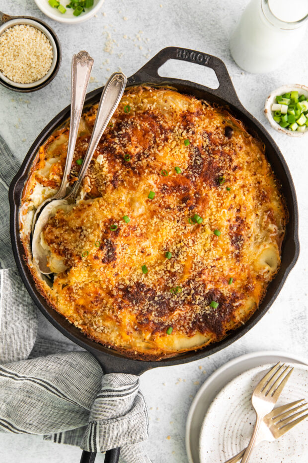 Homemade Scalloped Potatoes in a cast iron skillet.