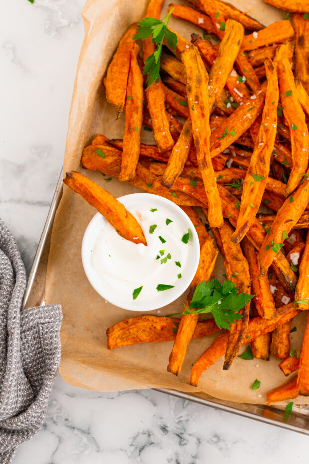 Sweet Potato Fries dipped into garlic mayonnaise. 