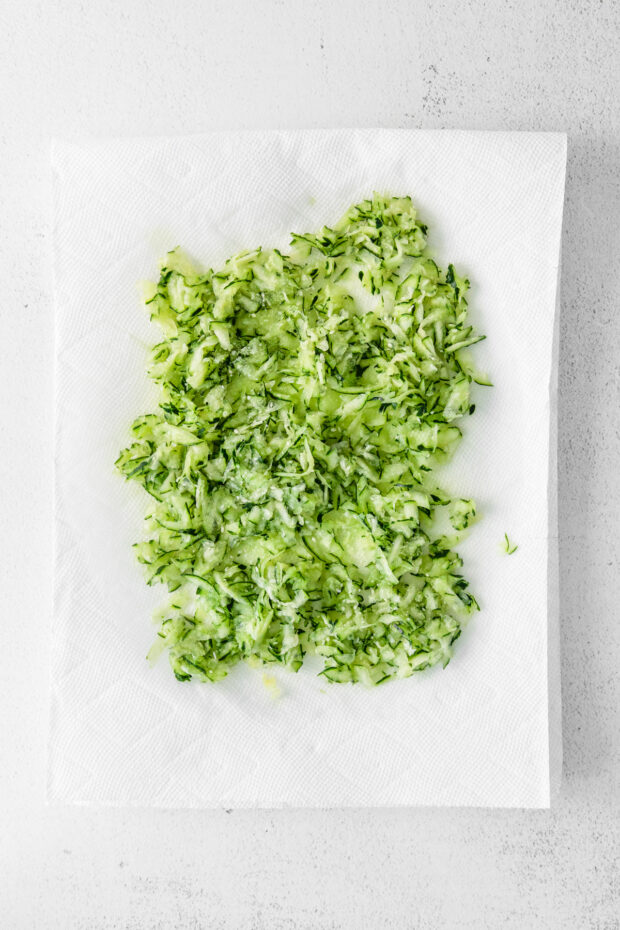 Shredded cucumbers on a paper towel.