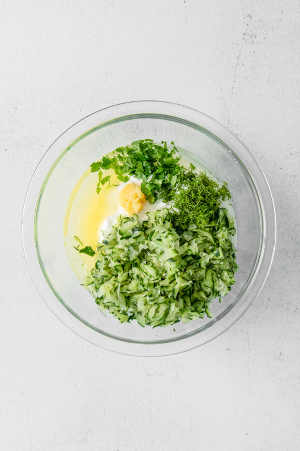 Tzatziki Sauce ingredients in a bowl not stirred together.