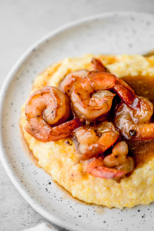 Cajun Honey Butter Shrimp and Grits served in a bowl.