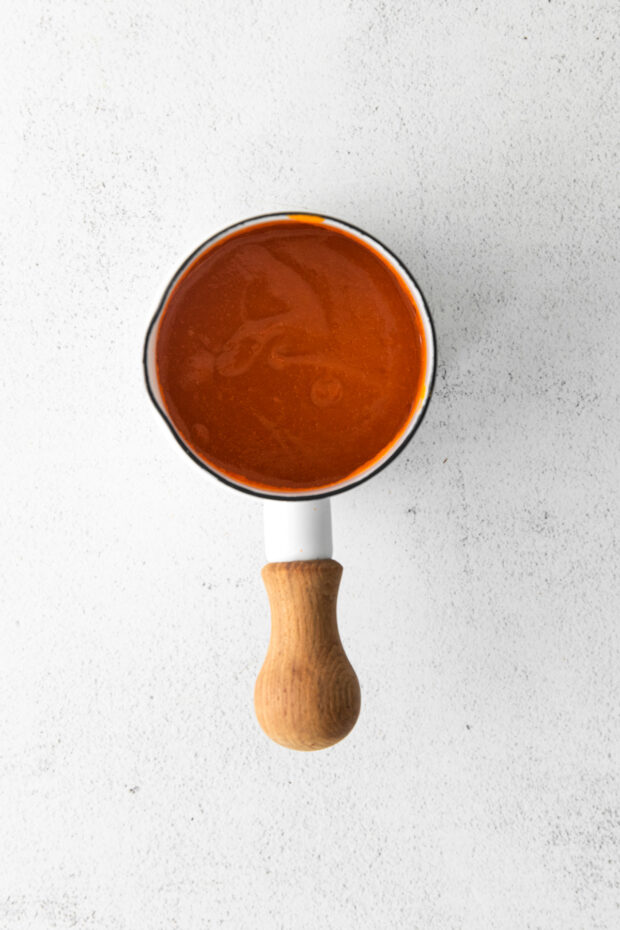 Buffalo sauce in a small saucepan. 