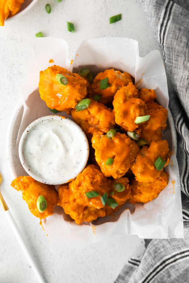 Air Fryer Buffalo Chicken Nuggets in a bowl with dipping sauce. 