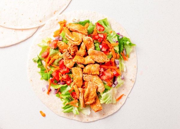 An open Buffalo Chicken Wrap before being wrapped. 