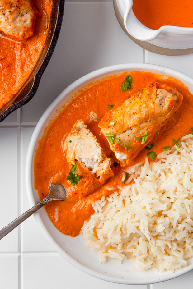 Creamy Chipotle Chicken on a plate served with rice. 