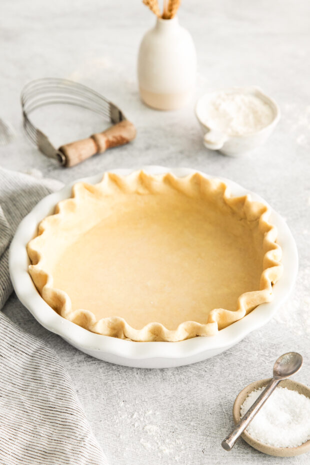 Homemade Buttery Pie Crust in a white pie plate.
