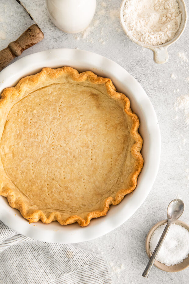 Homemade Buttery Pie Crust cooked in a pie plate.