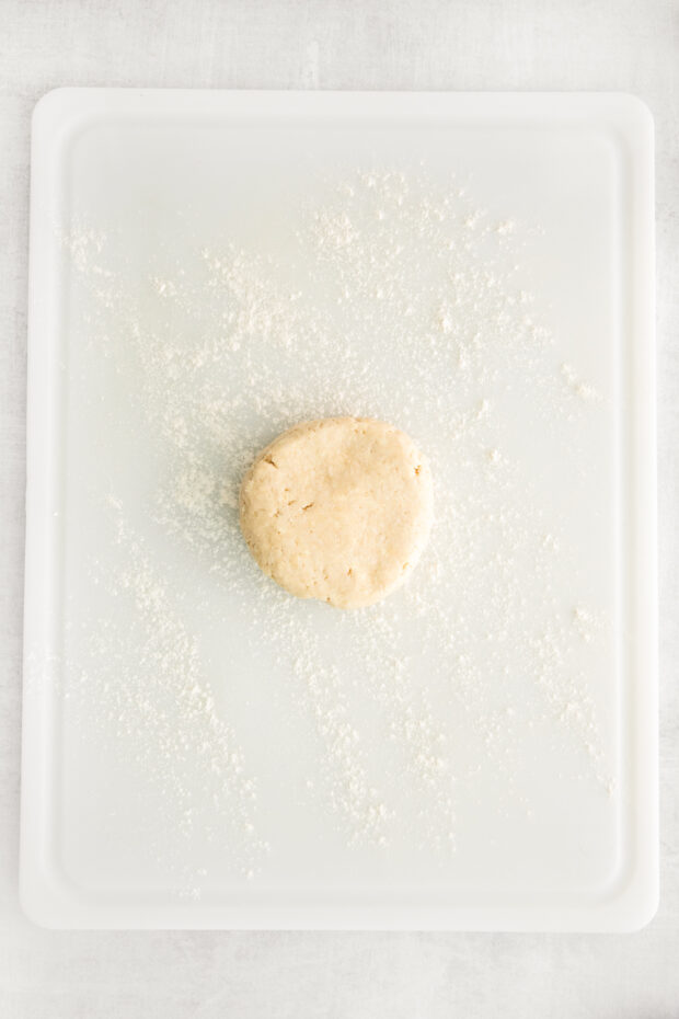 Homemade Buttery Pie Crust on a cutting board.