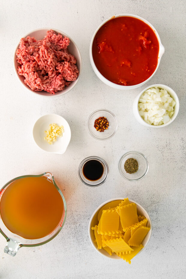 Ingredients to make lasagna soup on a table.