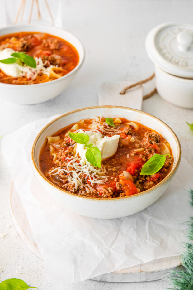Instant Pot Lasagna Soup served with shredded cheese.