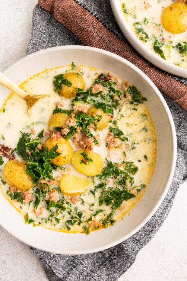 Instant Pot Zuppa Toscana Soup served with a spoon. 