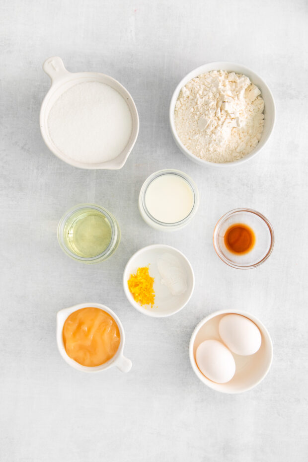 Ingredients to make lemon cupcakes on a table. 