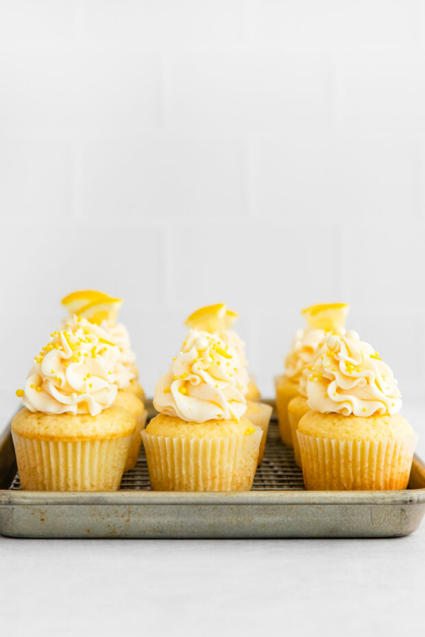Lemon Curd Cupcakes on a cooling rack. 
