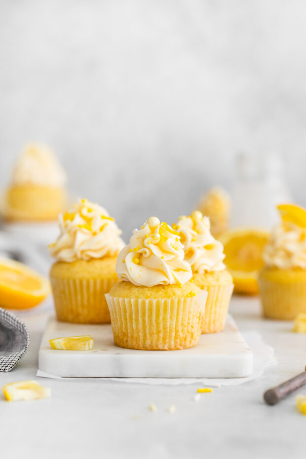 Lemon Curd Cupcakes topped with frosting and sprinkles. 