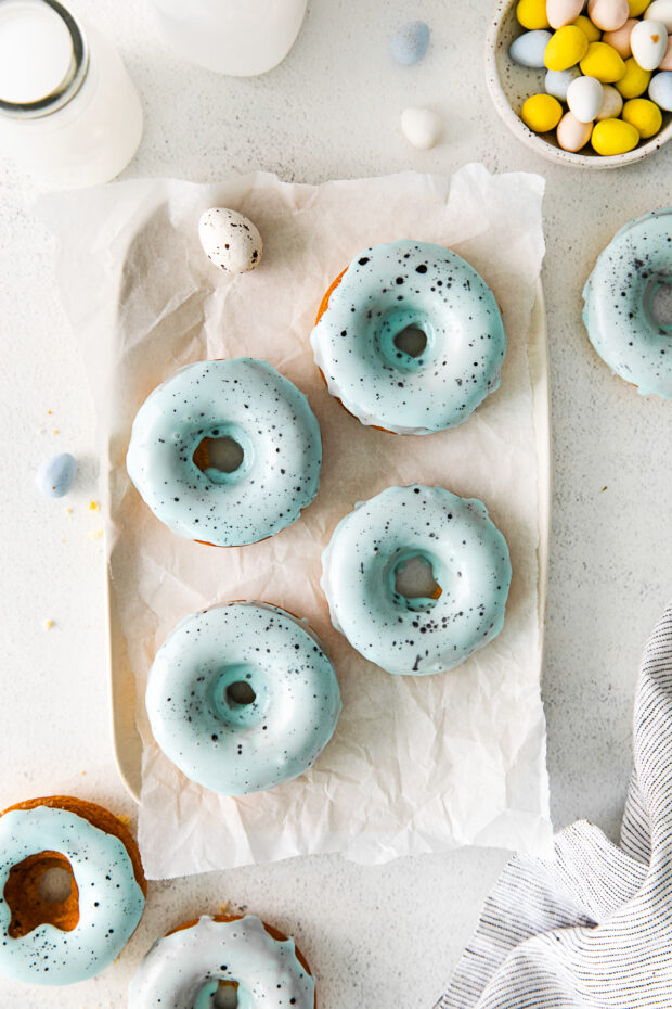 Robin's Egg Baked Donuts sitting on parchment paper. 
