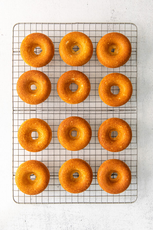 Baked donuts on a cooling rack. 
