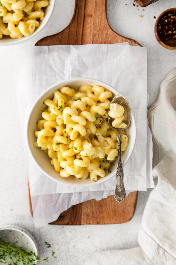 White Cheddar Mac and Cheese in a bowl with a spoon. 