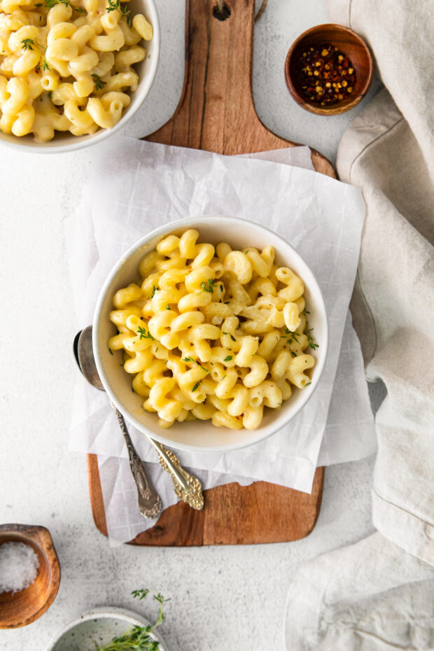 White Cheddar Mac and Cheese topped with thyme. 