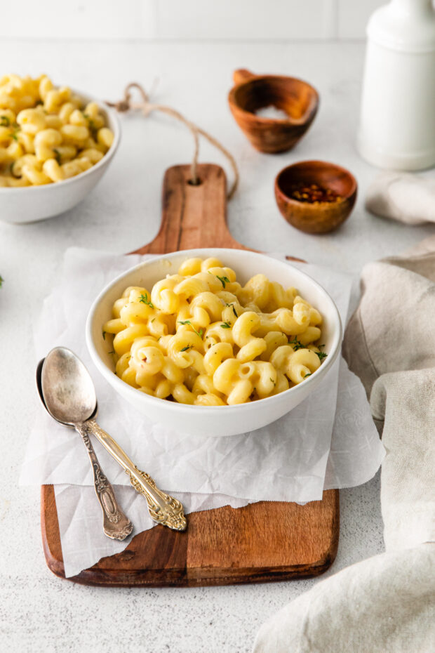 White Cheddar Mac and Cheese served with spoons. 