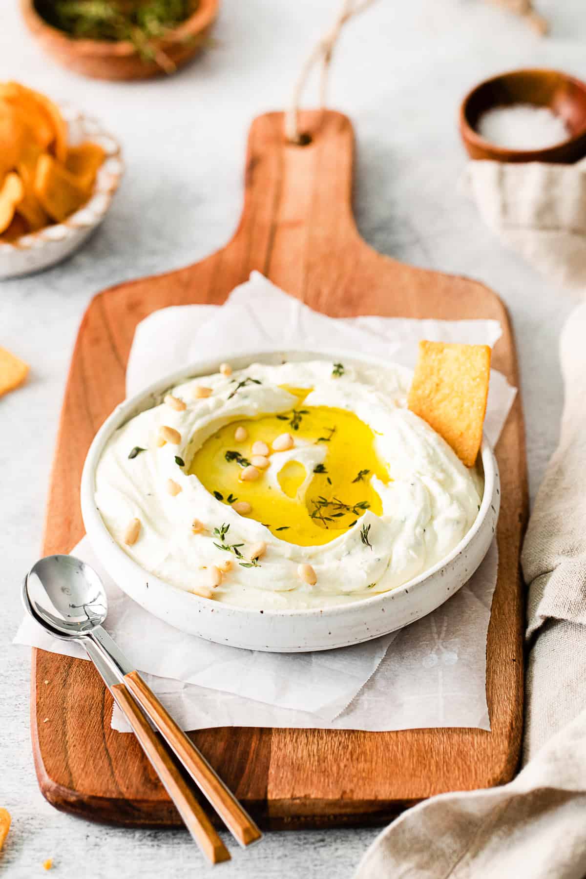 Roasted Garlic Whipped Feta in a bowl with olive oil.