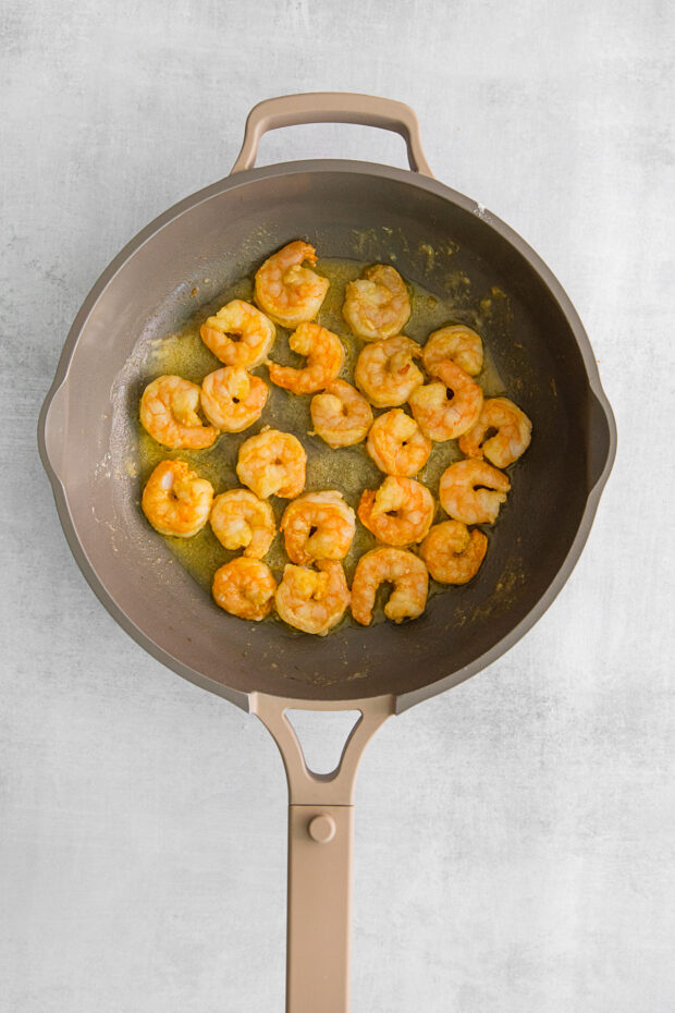 Fried shrimp in a skillet.