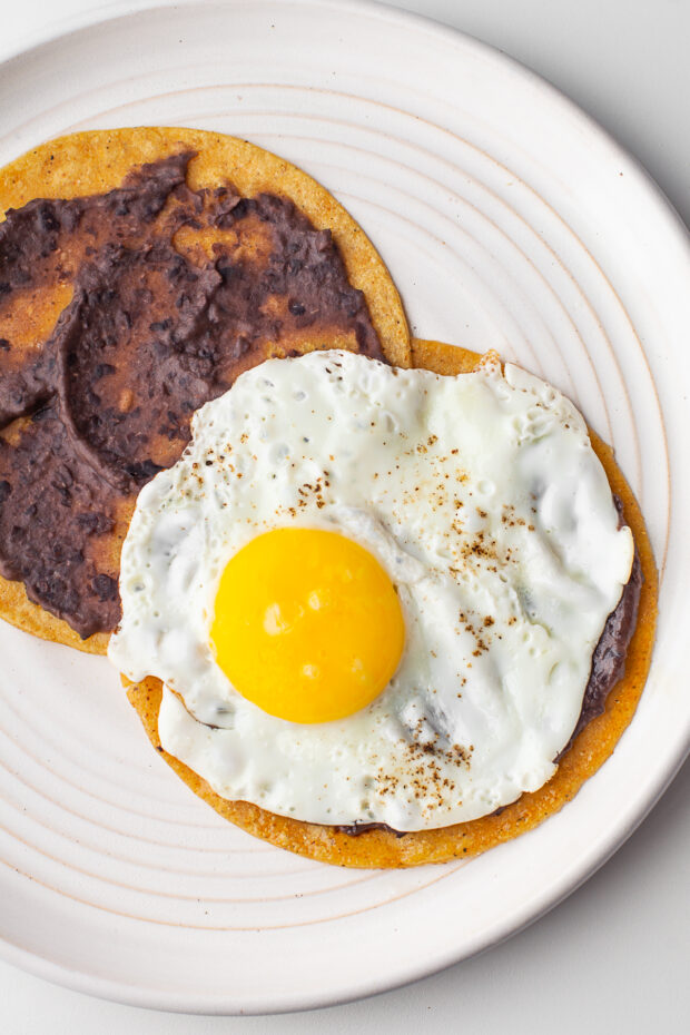 An egg on top of a tortilla. 