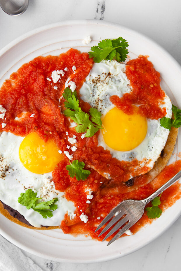 Huevos Rancheros on a white plate. 