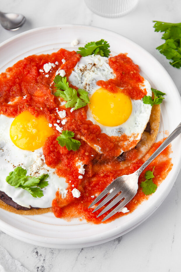 Huevos Rancheros served with a fork. 