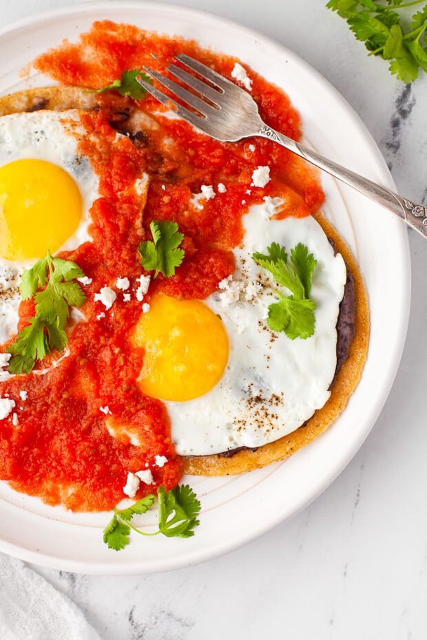 Huevos Rancheros served with cilantro and cotija cheese. 