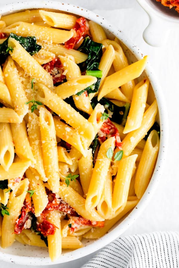 Sun dried Tomato and Kale Pasta garnished with extra grated Parmesan.
