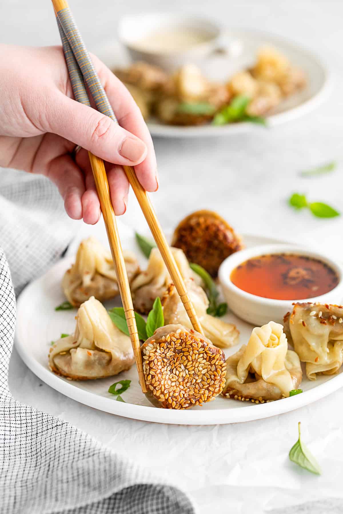 Chopsticks picking up Shiitake Mushroom Dumplings. 