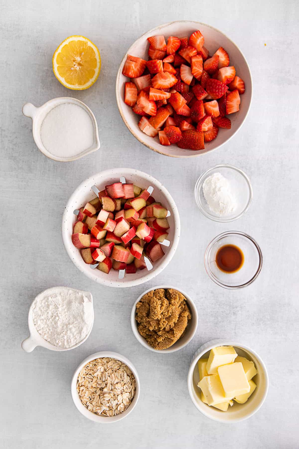 Ingredients for Strawberry Rhubarb Crisp on a table.
