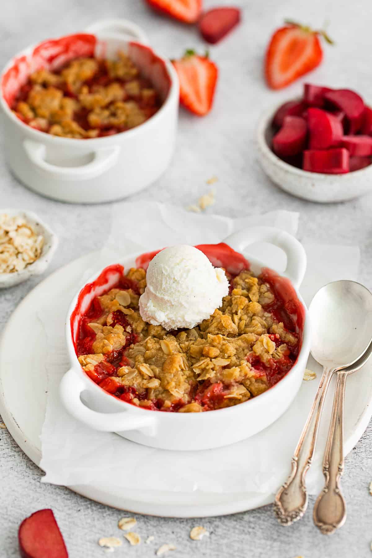 Strawberry Rhubarb Crisp topped with vanilla ice cream.