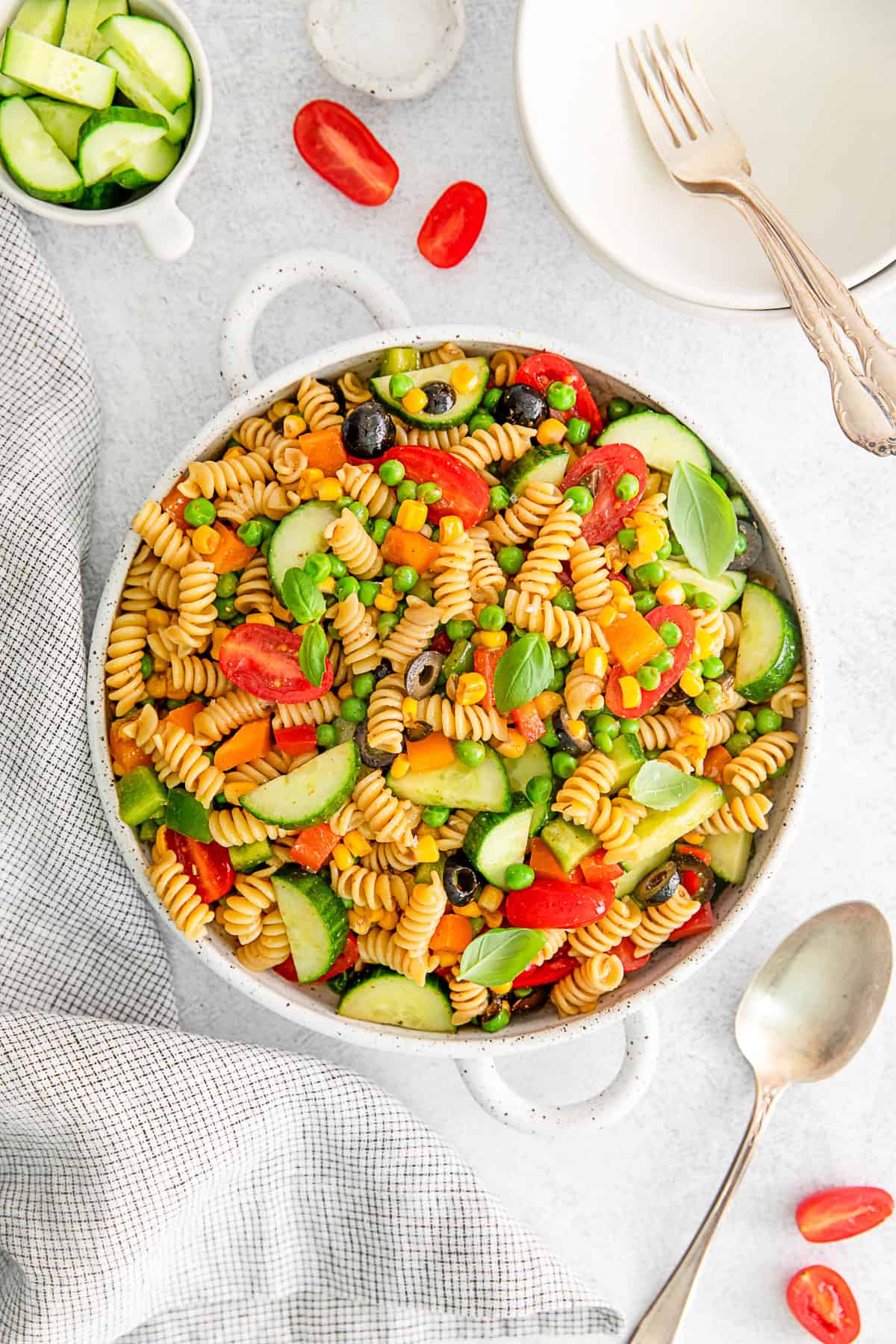 Summer Pasta Salad garnished with fresh basil. 
