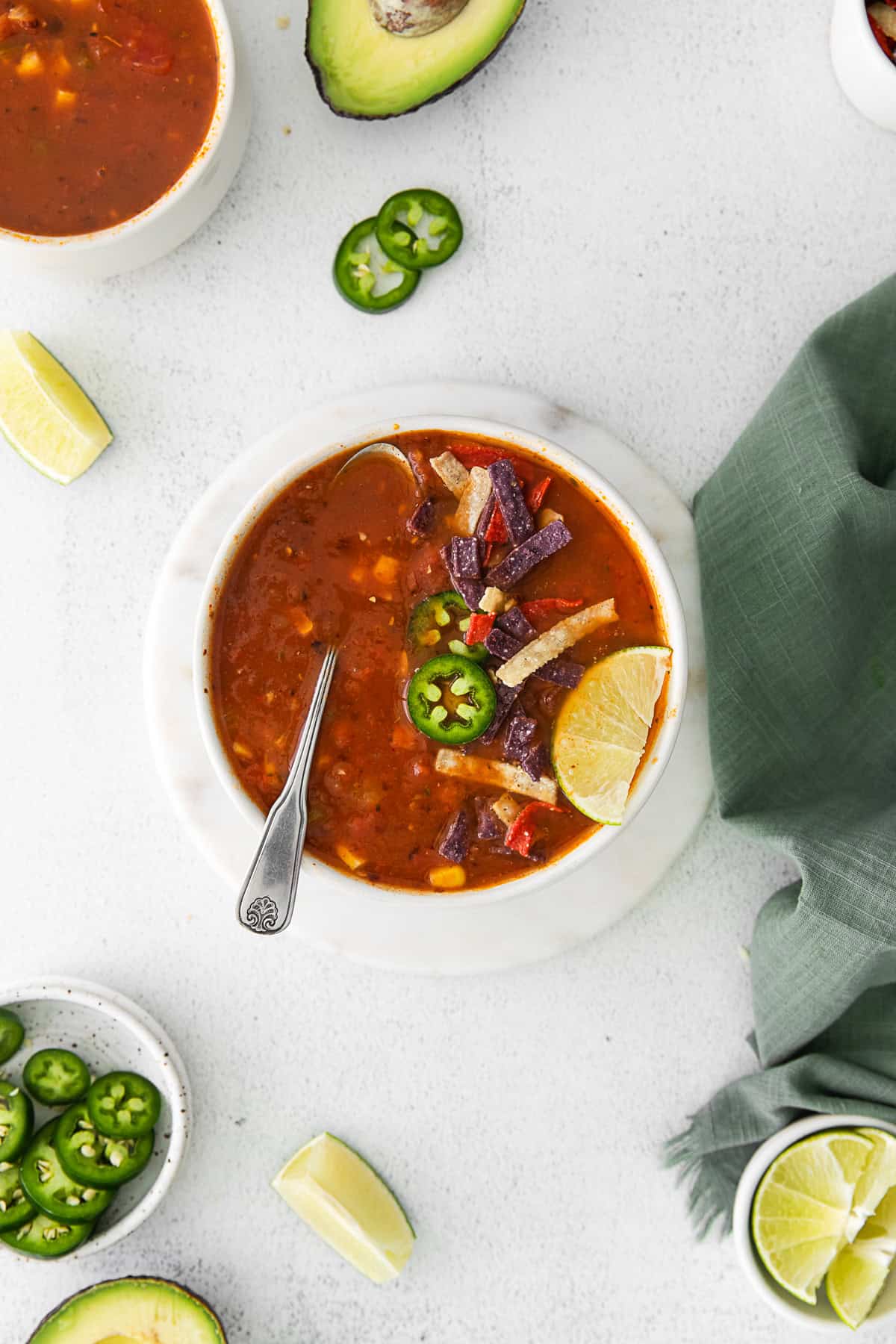 Vegan Tortilla Soup with a spoon in the bowl. 