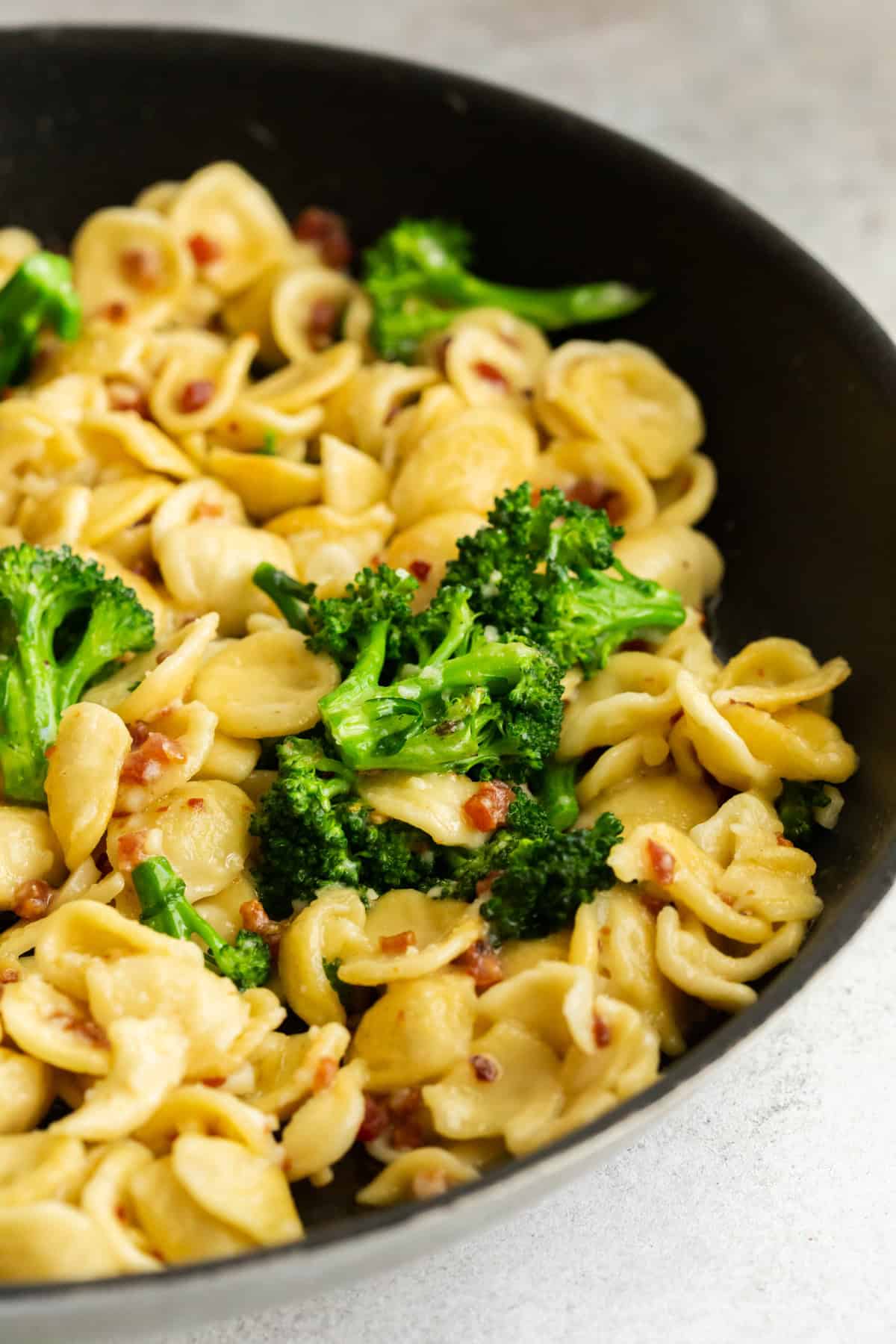 Broccoli Rabe Pancetta Pasta in a round skillet.