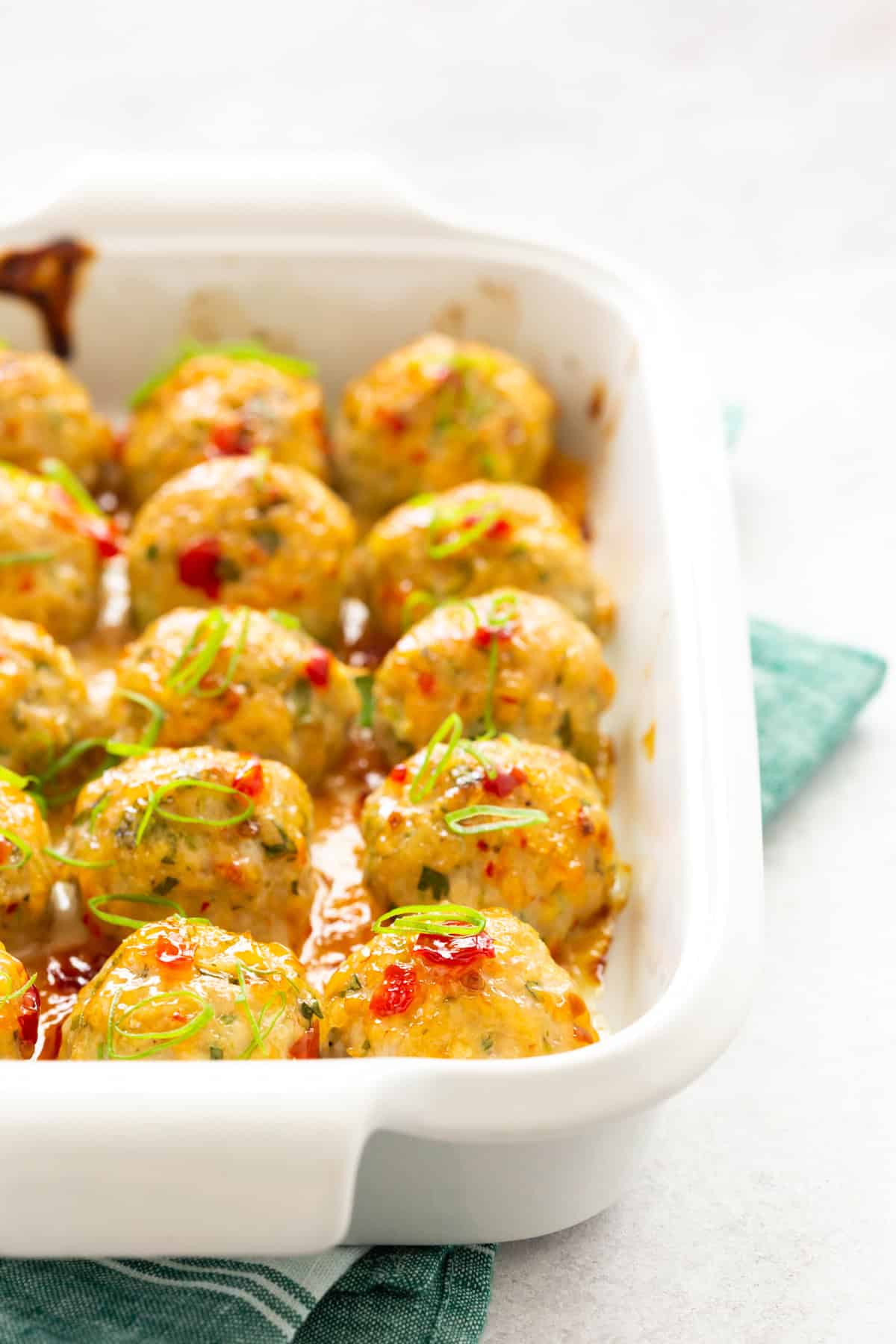 Easy Thai Baked Chicken Meatballs in a baking dish.
