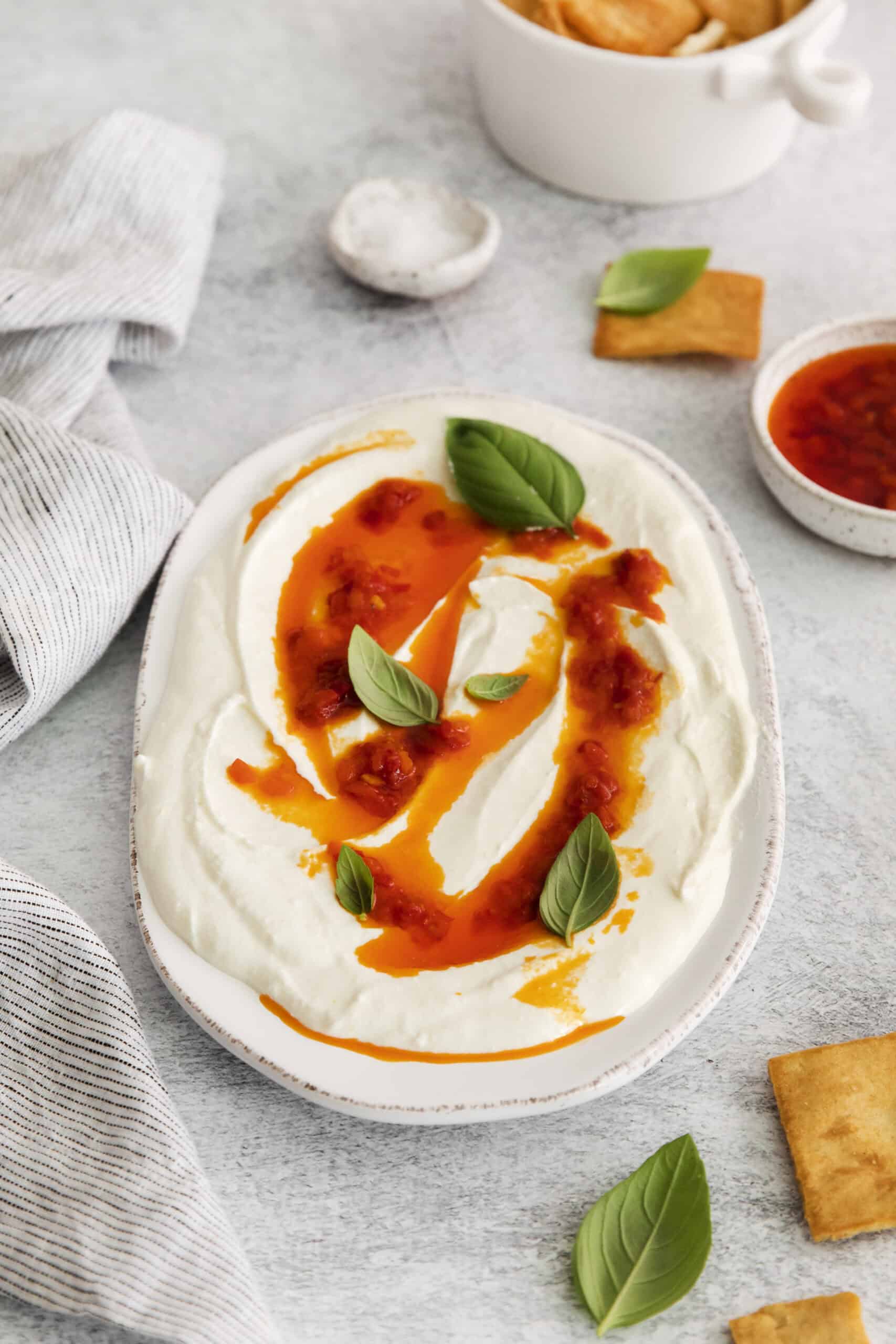 Harissa Whipped Feta on a white plate. 