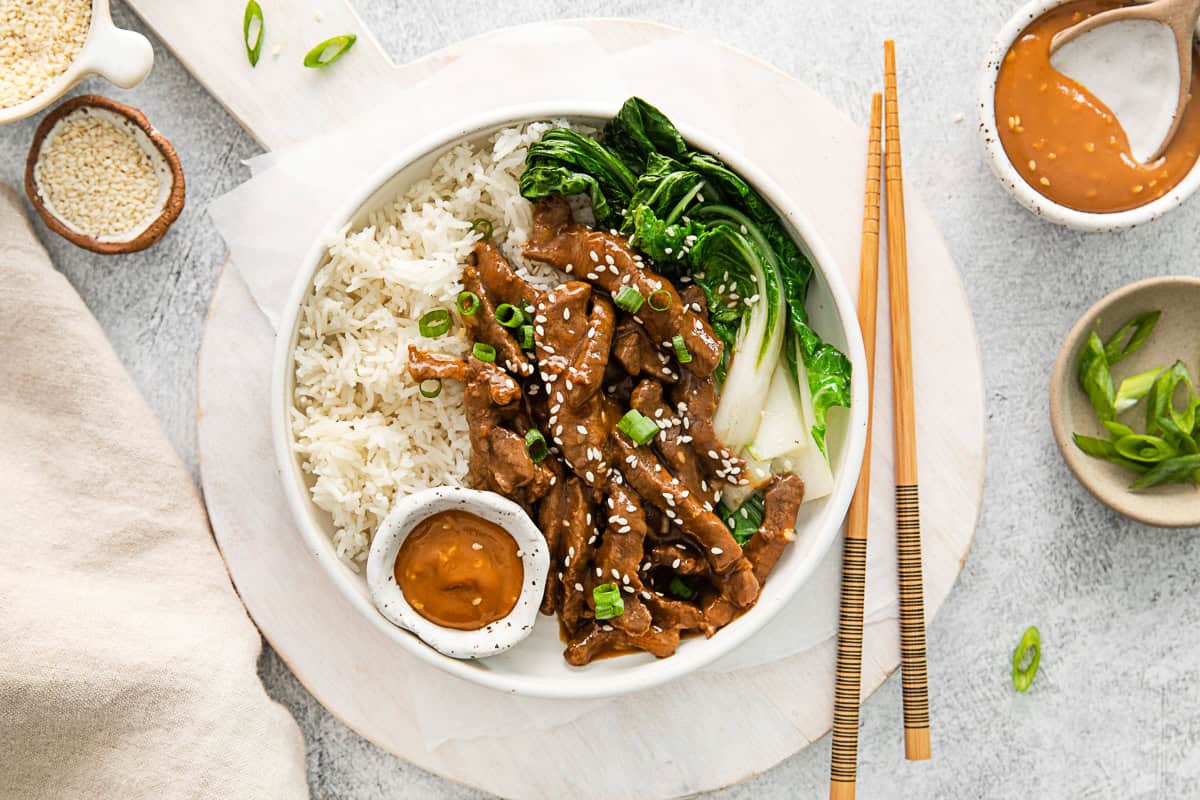 Beef Bulgogi Rice Bowls served with chopsticks. 