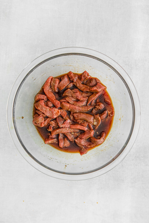 Marinating beef in a bowl. 